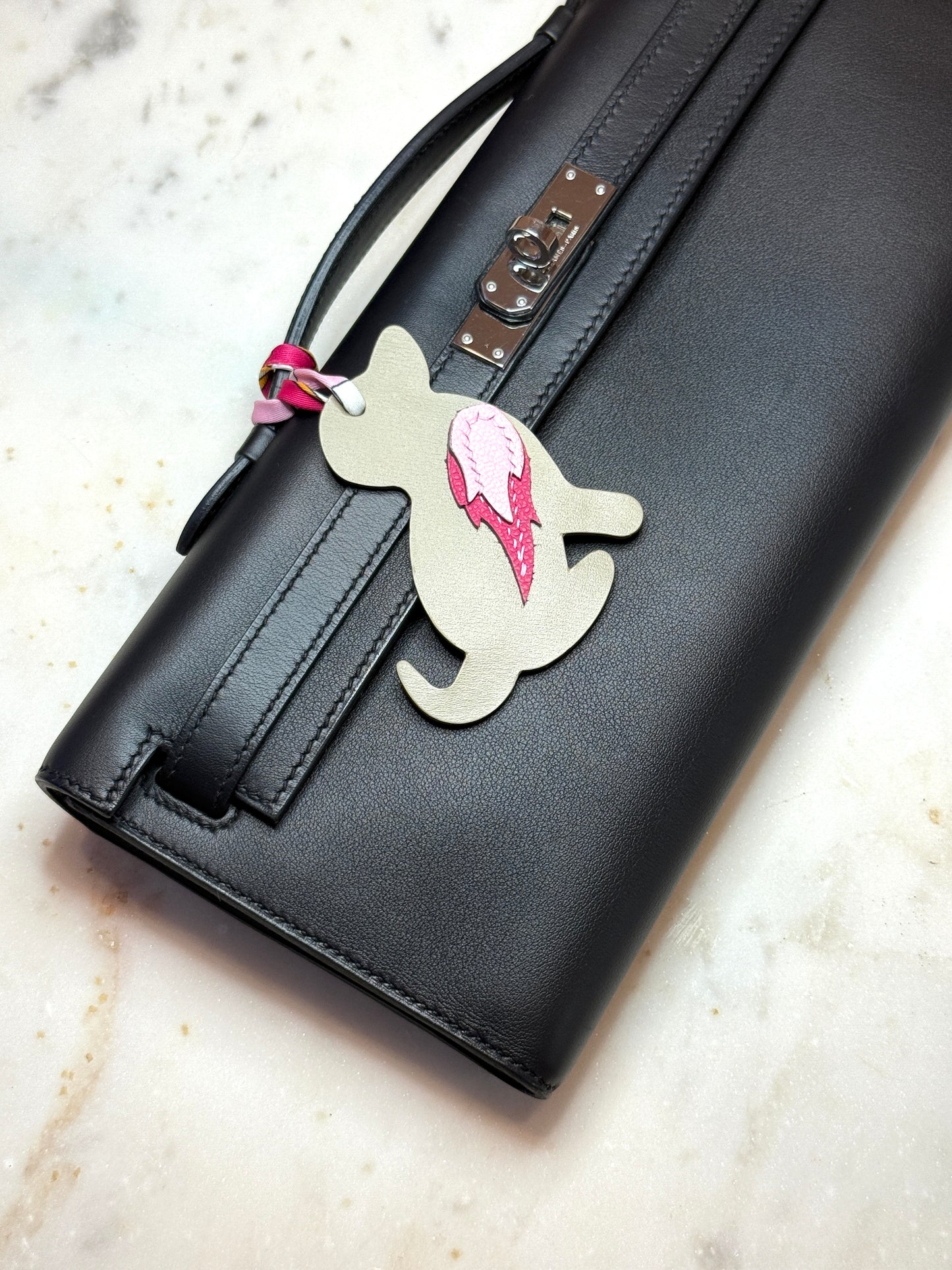 Dog charms in beige calfskin and pink goat skin