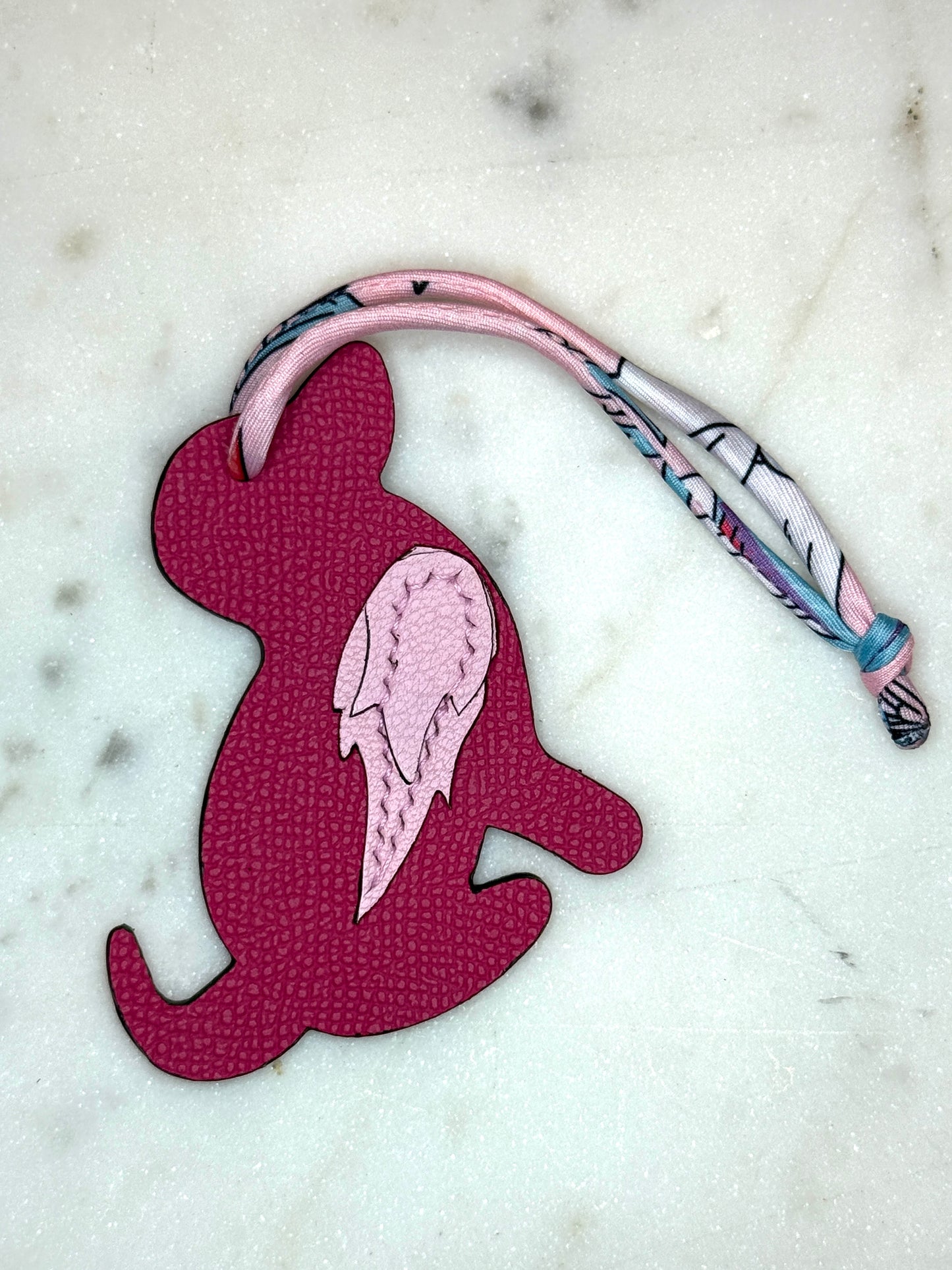 Dog bag charms pink calfskin and goat skin.