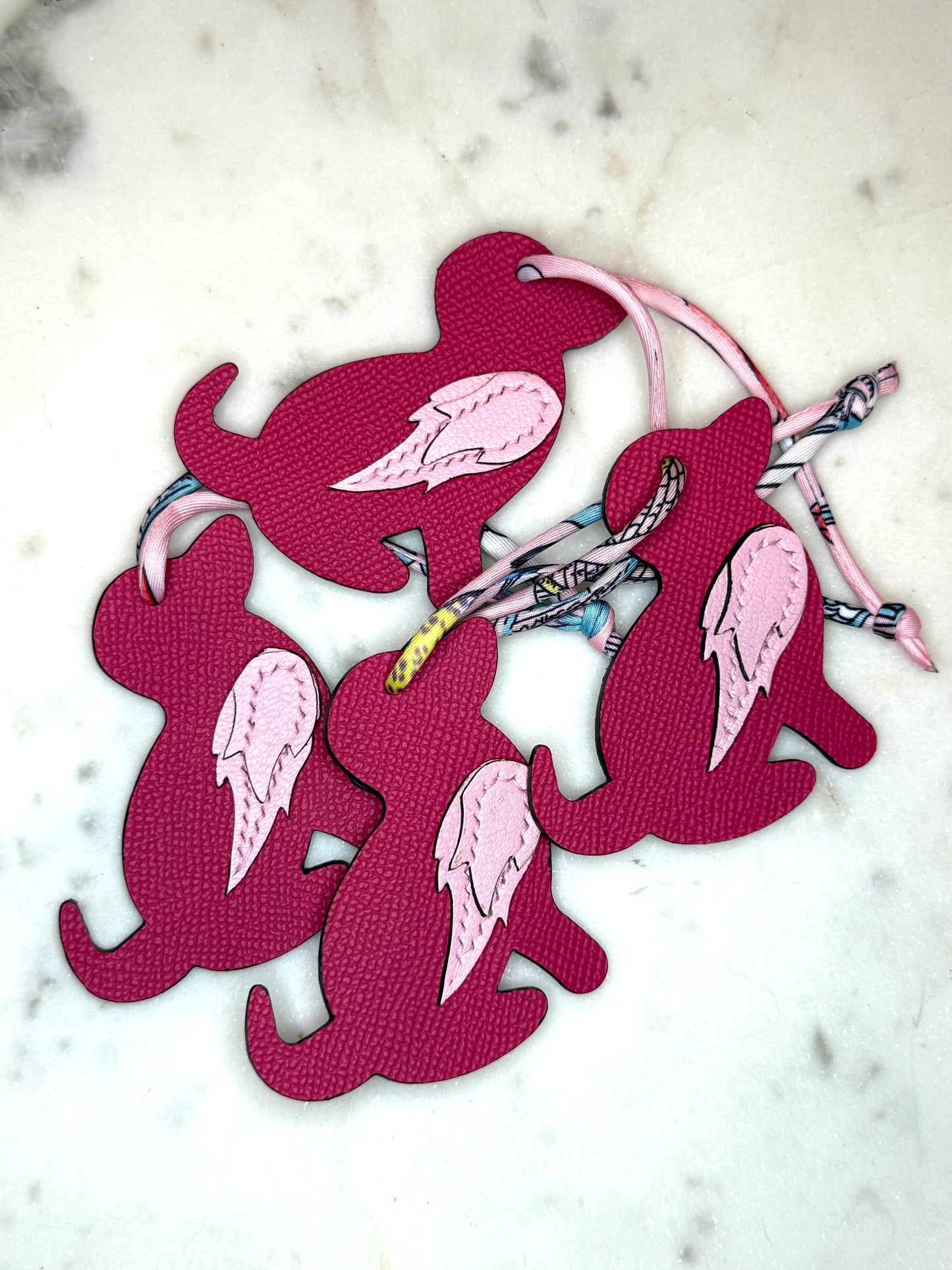 Dog bag charms pink calfskin and goat skin.
