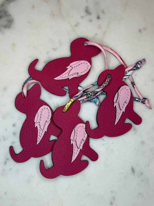 Dog bag charms pink calfskin and goat skin.