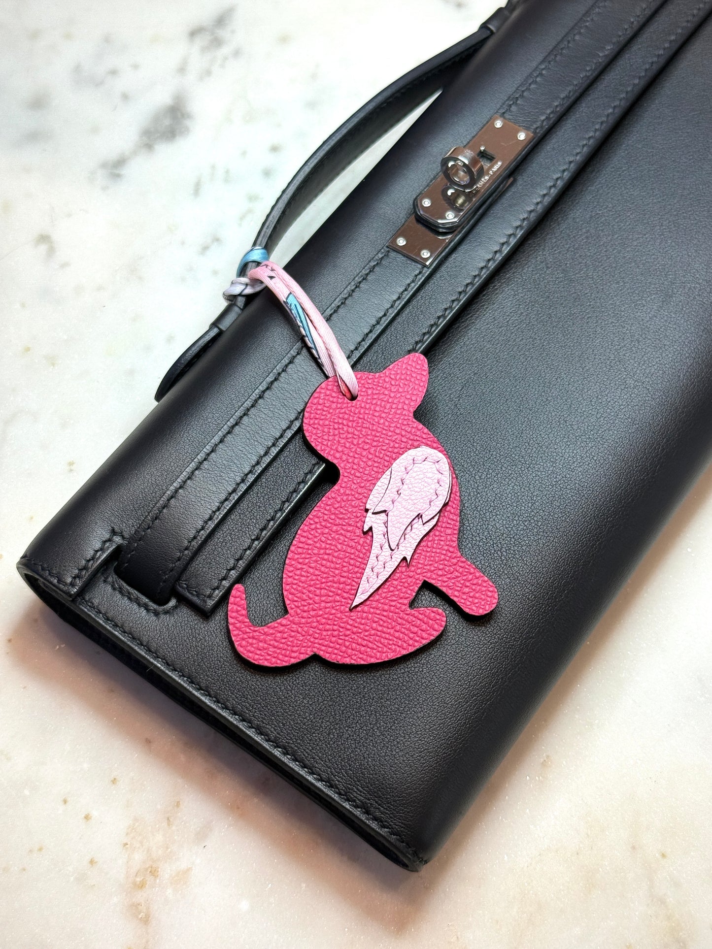 Dog bag charms pink calfskin and goat skin.